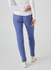 Women's Mavis Jogger in Blueberry, back model view featuring a medium blue waffle-knit jogger with elasticated waistband, clean back panel, and tapered leg with cuffed hem paired with a white long sleeve top and white athletic shoes