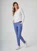 Women's Mavis Jogger in Blueberry, full length model view featuring a medium blue waffle-knit jogger with elasticated waistband, Straight Down logo patch, and tapered leg with ankle vent detail paired with a white long sleeve top and white athletic shoes