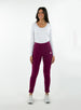 Women's Mavis Jogger in Dark Raspberry, full length model view featuring a deep berry waffle-knit jogger with elasticated waistband, Straight Down logo patch, and tapered leg with ankle vent detail paired with a white long sleeve top and white athletic shoes
