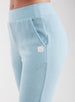 Women's Mavis Jogger in Mineral, close-up model view featuring a soft aqua waffle-knit jogger with elasticated waistband, angled side pocket, front seam detail, and tonal Straight Down logo patch