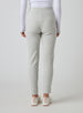 Women's Mavis Jogger in New Heather, back model view featuring a heather grey waffle-knit jogger with elasticated waistband, clean back panel, and tapered leg with cuffed hem paired with a white long sleeve top and white athletic shoes