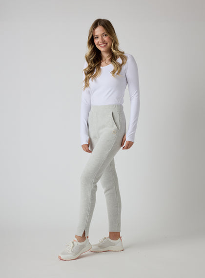 Women's Mavis Jogger in New Heather, full length model view featuring a heather grey waffle-knit jogger with elasticated waistband, tonal Straight Down logo badge, and tapered leg paired with a white long sleeve top and white athletic shoes