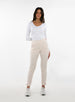 Women's Mavis Jogger in Oyster, full length model view featuring an off-white waffle-knit jogger with elasticated waistband, tonal Straight Down logo, and tapered leg with ankle vent detail paired with a white long sleeve top and white athletic shoes
