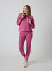 Women's Mavis Jogger in Rosewine, full length model view featuring a bold rose waffle-knit jogger with elasticated waistband and Straight Down logo patch paired with a matching waffle-knit hooded pullover and white athletic shoes