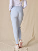 Women's Topia Jogger in Powder, back model view featuring a soft blue smooth-knit jogger with wide elasticated waistband and tonal Straight Down logo embroidery paired with a white long sleeve top and white athletic shoes