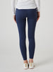 Sedona Legging in New Indigo, on model back view showing the solid navy high-waisted legging with side pockets, styled with a white long sleeve top