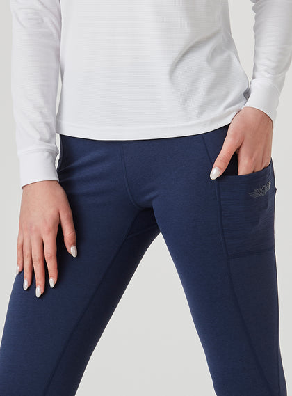 Sedona Legging in New Indigo, on model close-up side view highlighting the side pocket with Straight Down logo detail on the solid navy legging