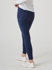 Sedona Legging in New Indigo, on model side view showing the solid navy high-waisted legging with Straight Down logo on the side pocket, styled with a white long sleeve top and white shoes