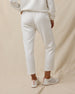 Woman wearing the Chelsea Pant in Coconut, showing the high-rise fit, front pleats, and cropped length.