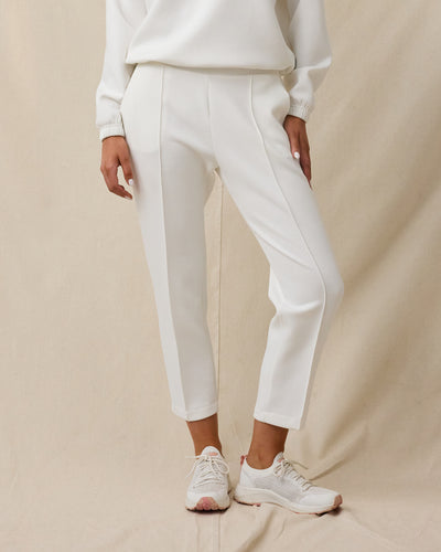 Women’s Chelsea Pant in Coconut featuring a high-rise waistband, front pleats, and a cropped straight-leg silhouette.
