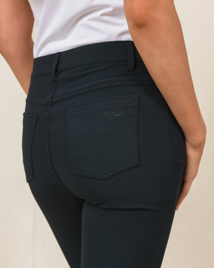 Women's Stride Pant in Black, detail close-up view featuring the back pocket with tonal Straight Down logo embroidery and waistband construction