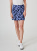Women's Evie Skort in Blueberry, front model close-up view featuring a navy and steel blue bold abstract floral print skort with a clean waistband and side pocket, styled with white shoes