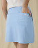 Evie Skort in Carolina, close-up back view on model highlighting the back patch pocket and Straight Down logo detail