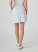 Women's Evie Skort in Powder, back model view featuring a light blue and white all-over leaf print skort with a Straight Down logo embroidered at the back waistband and white shoes