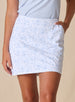 Women's Ava Skort in Powder, close-up detail view featuring an allover scattered floral print with light blue blooms on a white base