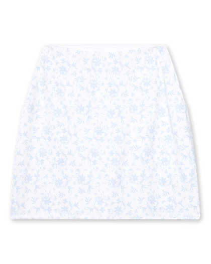 Women's Ava Skort in Powder, flat lay front view featuring an allover scattered floral print with light blue blooms on a white base