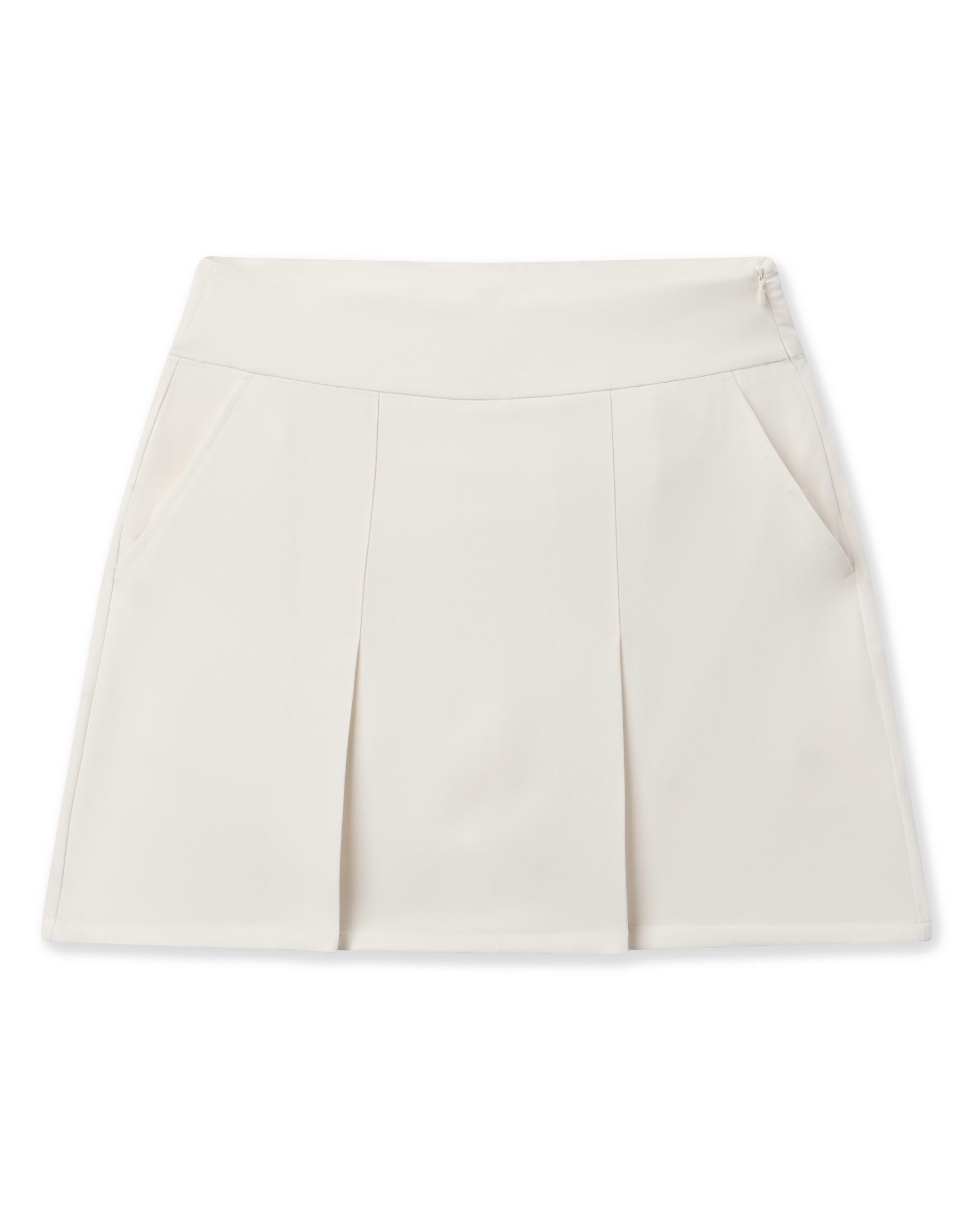 Korra Skort in Coconut with front pleats, side pockets, and a modern A-line silhouette
