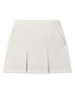 Korra Skort in Coconut with front pleats, side pockets, and a modern A-line silhouette