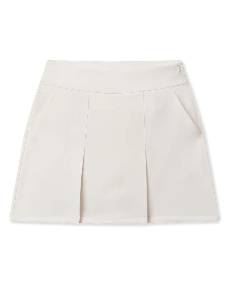Korra Skort in Coconut with front pleats, side pockets, and a modern A-line silhouette