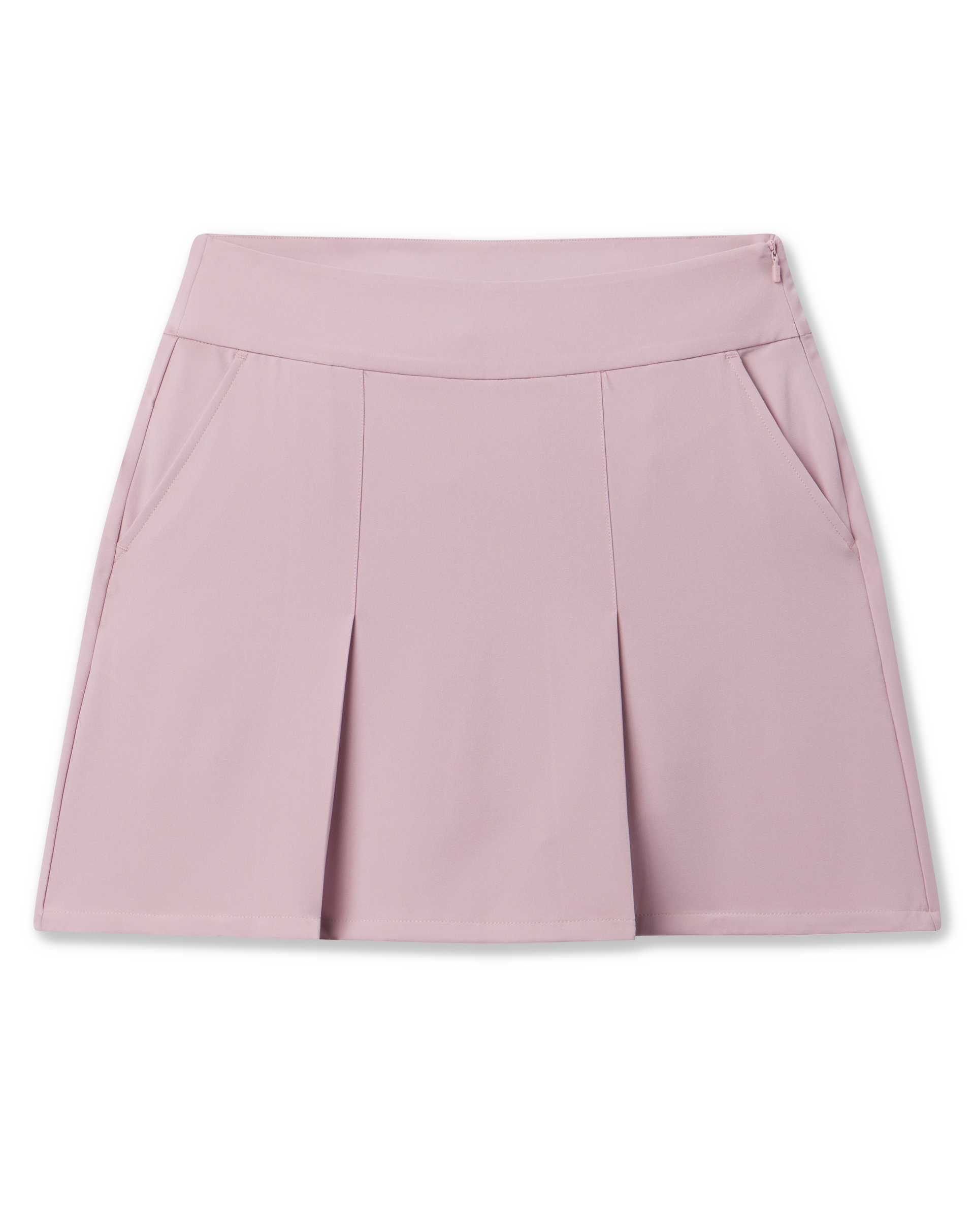 Korra Skort in Pink Dawn featuring a soft pink hue, front pleats, and side pockets