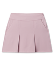Korra Skort in Pink Dawn featuring a soft pink hue, front pleats, and side pockets