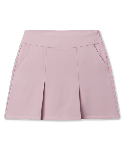 Korra Skort in Pink Dawn featuring a soft pink hue, front pleats, and side pockets