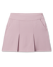 Korra Skort in Pink Dawn featuring a soft pink hue, front pleats, and side pockets