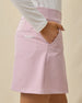 Side view of the Korra Skort in Pink Dawn featuring hand in front pocket