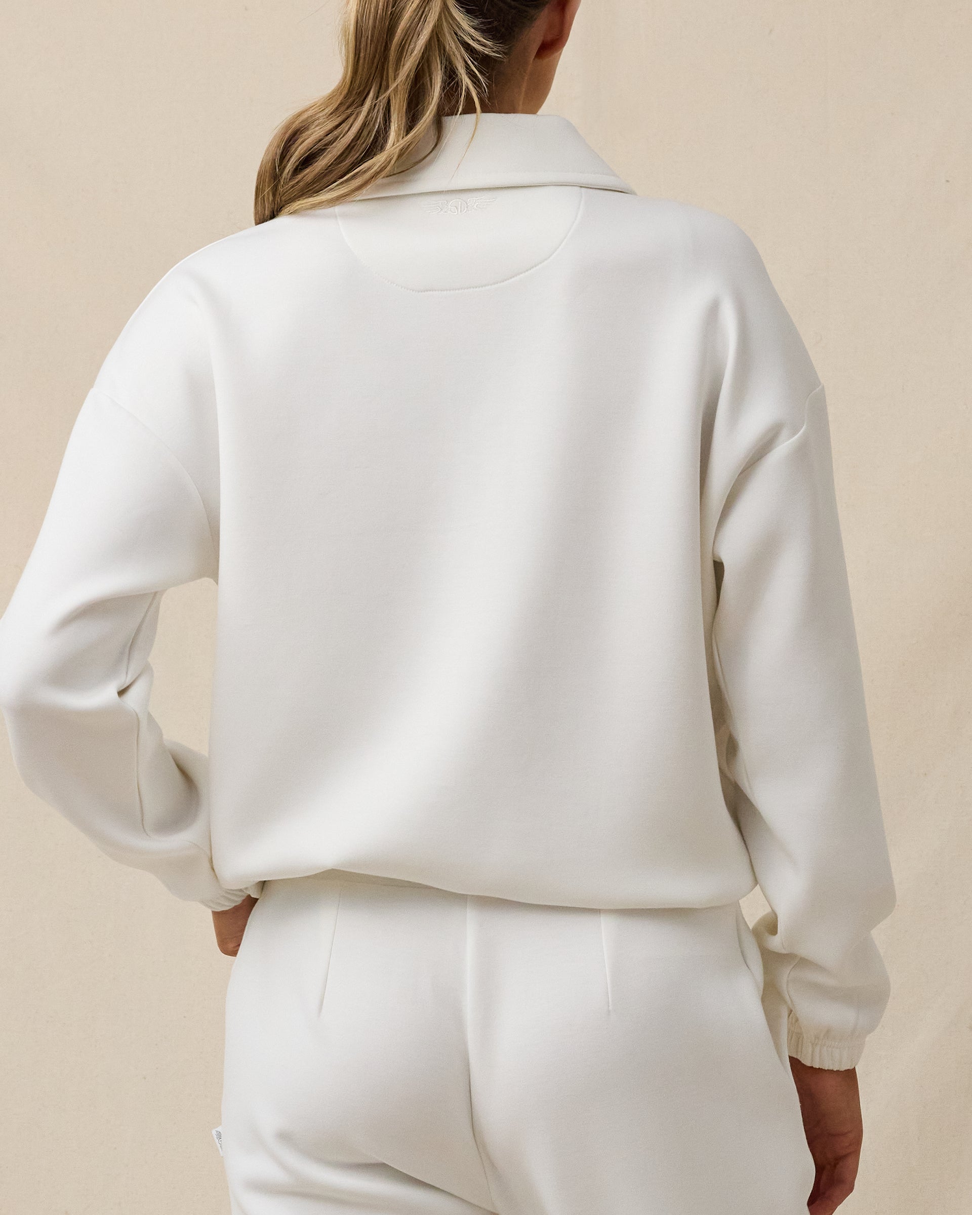 Back view of the Harper Quarter Button women's scuba knit pullover in Coconut