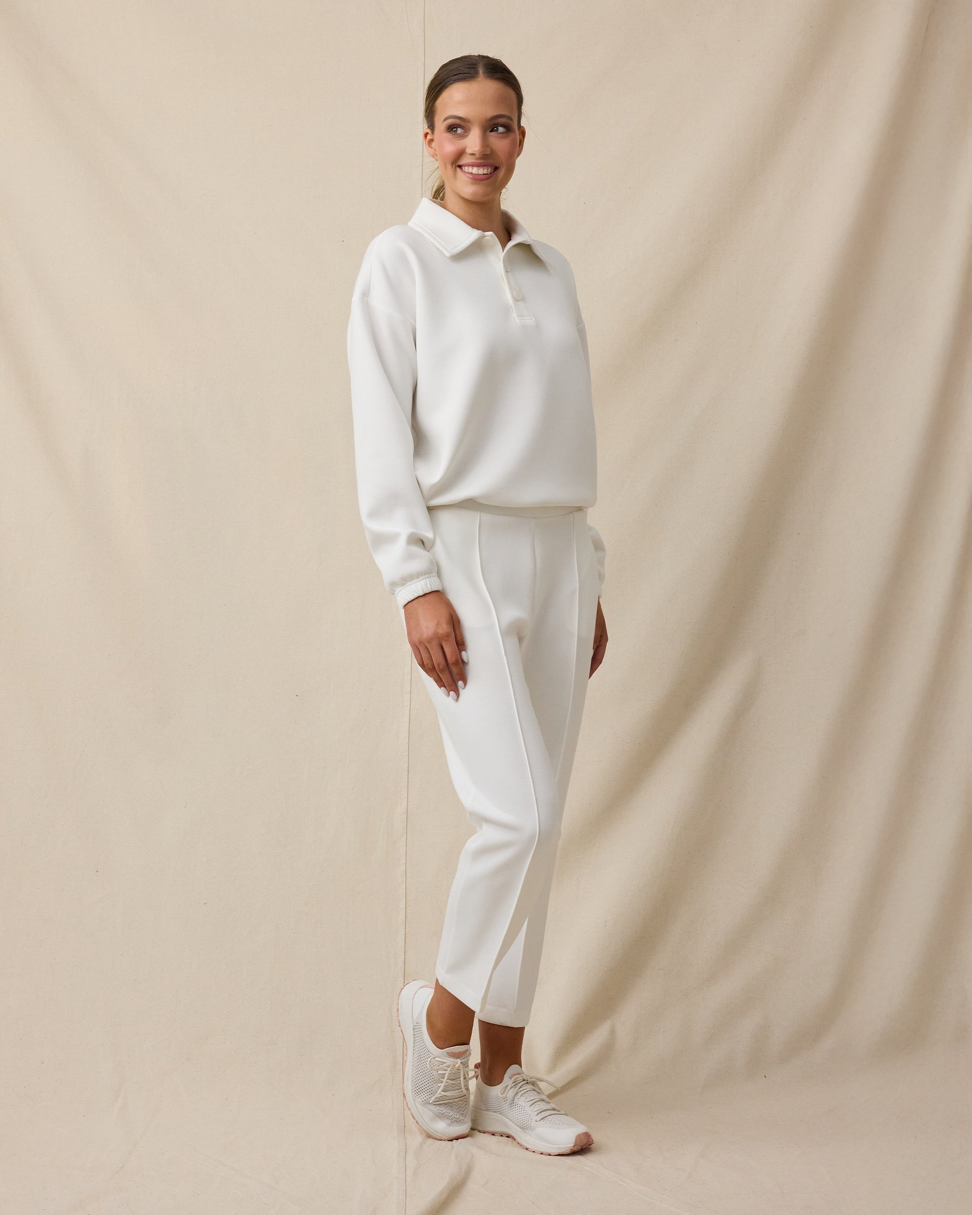 Model wearing the Harper Quarter Button in Coconut with matching scuba knit pants