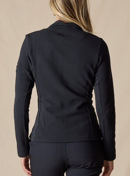 Swing Jacket in Black, back view on model featuring solid black fabric with subtle horizontal texture and Straight Down logo embroidery at upper back styled with black pants