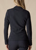Swing Jacket in Black, back view on model featuring solid black fabric with subtle horizontal texture and Straight Down logo embroidery at upper back styled with black pants