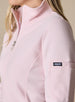 Swing Jacket in Light Pink, close up detail view on model showing the sleeve Straight Down logo tab, subtle horizontal texture, stand collar, and silver zip pull in solid light pink fabric