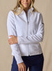 Swing Jacket in White, front view on model featuring solid white fabric with subtle horizontal texture, full zip closure, and stand collar styled with navy pants