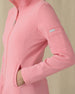 Women's Swing Jacket in Geranium, close-up detail view featuring the ribbed texture, side pocket, and Straight Down logo sleeve tab on a pink full zip jacket