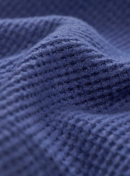 Women's Misty Top in Blueberry, extreme close-up view highlighting the blueberry waffle knit fabric texture and seam detail