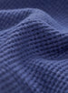 Women's Misty Top in Blueberry, extreme close-up view highlighting the blueberry waffle knit fabric texture and seam detail