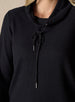 Women's Misty Top in Black, close detailed view featuring a solid black waffle knit long sleeve top with cowl neck and drawstring tie