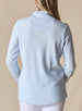 Women's Misty Top in Lake, back view on model featuring a solid light blue waffle knit long sleeve top with cowl neck