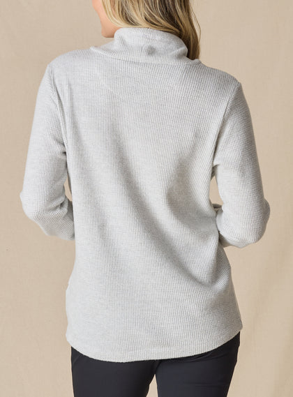 Women's Misty Top in New Heather, back view on model featuring a heather gray waffle knit long sleeve top with cowl neck