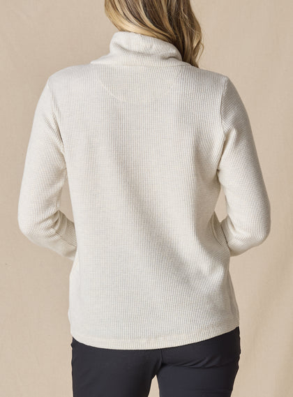 Women's Misty Top in Oatmeal, back view on model featuring a cream waffle knit long sleeve top with cowl neck