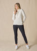  Women's Misty Top in Oatmeal, full length front view on model featuring a cream waffle knit long sleeve top with cowl neck and drawstring tie, paired with black pants and white sneakers