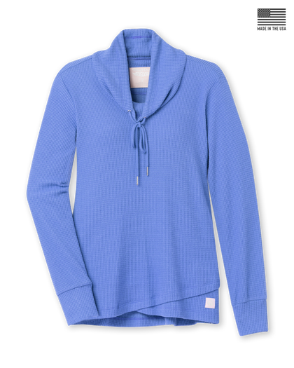 Women's Misty Top in Blueberry, flat lay front view featuring solid medium blue waffle knit fabric, shawl collar with drawstring tie, long sleeves with ribbed cuffs, crossover hem, and Straight Down logo patch at the hip