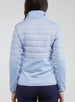 Straight Down Women's Pines Jacket in Powder, rear model view showing light blue quilted back with stretch side panels and Straight Down logo at upper back