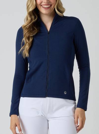 Straight Down Women's Celeste Jacket in Indigo, front view on model featuring a navy full-zip jacket with mock neck collar, paired with white pants
