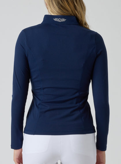 Straight Down Women's Celeste Jacket in Indigo, back view on model featuring a navy full-zip jacket with the Straight Down logo at the back collar, paired with white pants