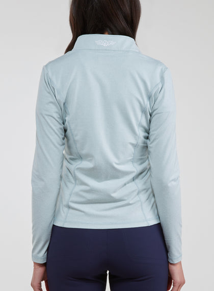 Straight Down Women's Celeste Jacket in Mineral, back view on model featuring a light sage green full-zip jacket with the Straight Down logo at the back collar, paired with navy pants
