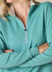 Women's Opal Half Zip in Sea Green, close-up front detail view featuring the waffle-texture fabric, contrast striped zipper, white collar lining, and ribbed cuffs