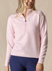Women's Opal Half Zip in Soft Pink, front view on model featuring a light pink waffle-textured pullover with a quarter-zip neckline paired with navy pants