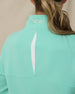 Opal Half Zip in Cascade Green, back vent and logo detail